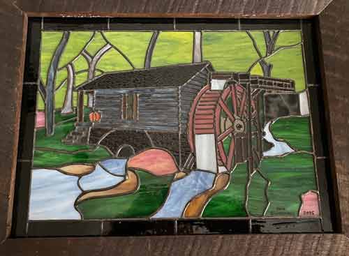 stained glass of mill on stream
